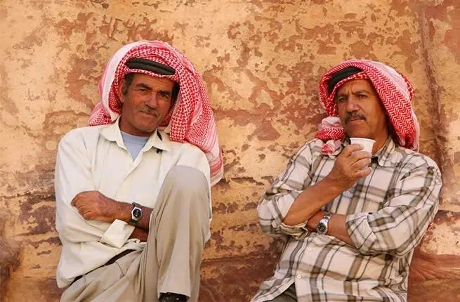 Two-arab-men-drinking-cofee-2016.webp