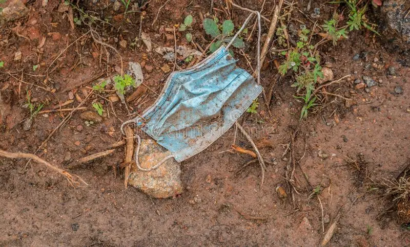 used-discarded-face-mask-dumped-ground-outdoors-laying-dirt-as-garbage-polluting-environment-...webp