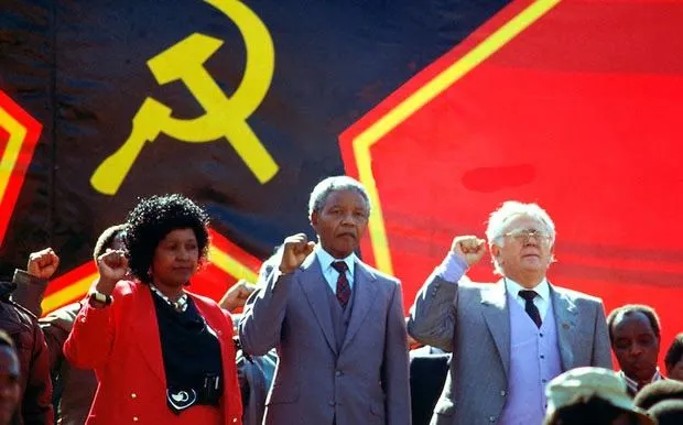 Winnie_Mandela_Nelson_Mandela_Yossel_Joe_Slovo_hammer_and_sickle_red_star_flag_banner.webp
