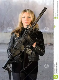 armed-beautiful-young-woman-rifle-neglected-house-33661054.webp