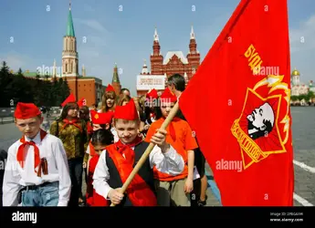 children-wearing-red-ties-a-symbol-of-the-young-pioneers-march-along-red-square-after-a-cerem...webp