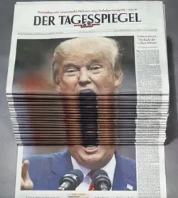 Trump newspaper stack.webp