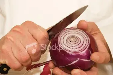 $stock-photo-5464731-hands-of-a-cook-peeling-an-onion.webp