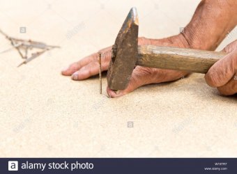 the-man-hit-his-finger-with-a-hammer-professional-carpentry-woodwork-and-people-concept-of-inj...jpg