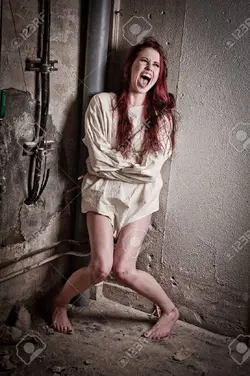 10291375-an-insane-psycho-girl-wearing-a-straight-jacket-Stock-Photo-bondage.webp