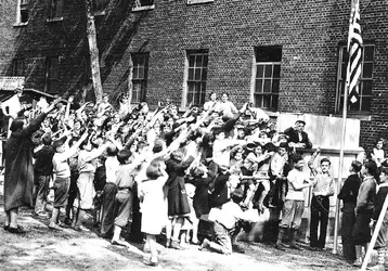 children-salutes-flag-Irene-Kaufmann-Settlement-1934-1567807121.webp