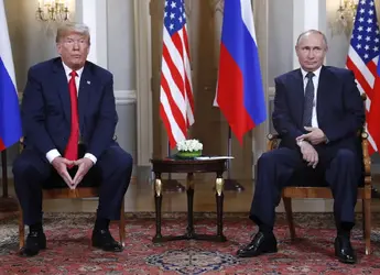 Trump sitting w Putin.webp