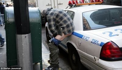 $OWS member defecating on police car.jpg