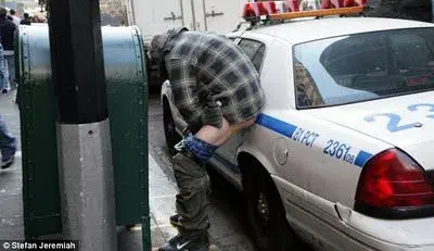 $OWS member defecating on police car.webp $OWS member defecating on police car.webp