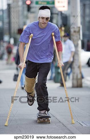 man-crutches-riding_~spm23019.jpg