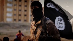 141117103601-isis-masked-militant-flag-hp-video.jpg