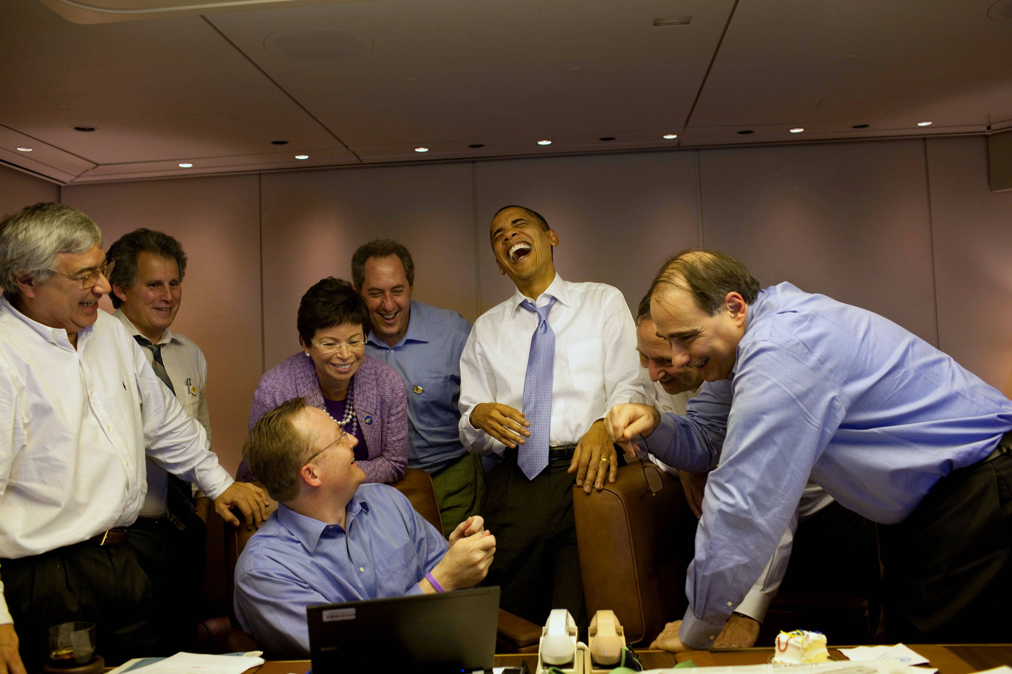 Barack_Obama_laughs_with_his_staff_on_Air_Force_One.jpg