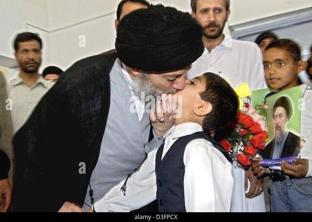 dpa-shiite-cleric-mohammed-baqir-al-hakim-kisses-a-child-as-he-is-d3fpcx.jpg