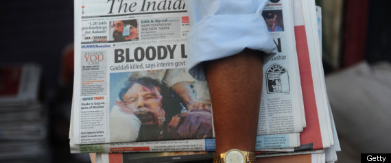 r-GADDAFI-DEAD-BURIAL-large570.jpg