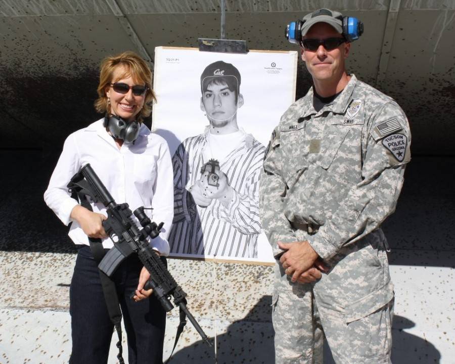 Former-Congresswoman-spree-killer-survivor-and-gun-control-advocate-and-Tucson-policeman-after-shooting-a-white-guy-with-a-MAC-10-courtesy-faceboook.com_-900x720.jpg