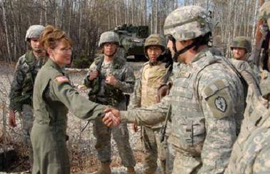 sarah-in-fatigues-shaking-hands-with-military.jpg