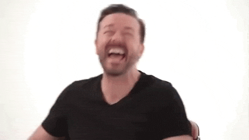 Ricky-Gervais-Putting-Head-Back-and-Laughing.gif