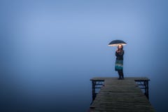lonely-woman-bridge-umbrella-27480183.jpg