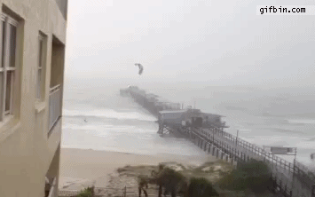 1340902539_kite_surfer_flies_over_pier.gif