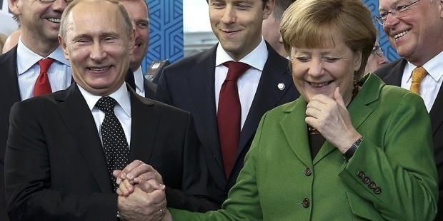 ob_0d8bc1_poutine-merkel.jpg