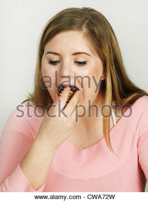hamburg-a-fat-girl-eating-a-chocolate-kiss-cwa72w.jpg