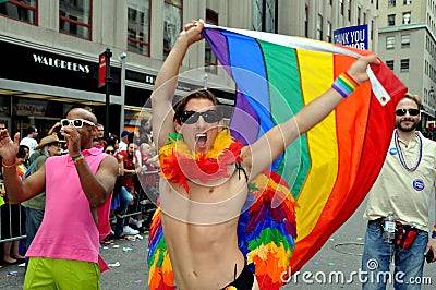 nyc-exuberant-man-rainbow-flag-20089442.jpg
