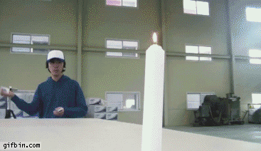 1341421794_putting_out_candle_with_playing_card.gif