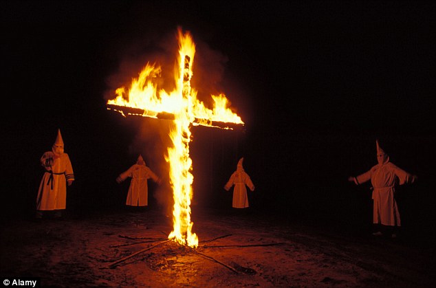 1415616389664_wps_12_Ku_Klux_Klan_burning_cros.jpg