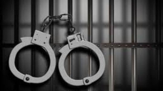 jail%20cell%20handcuffs_3.jpg