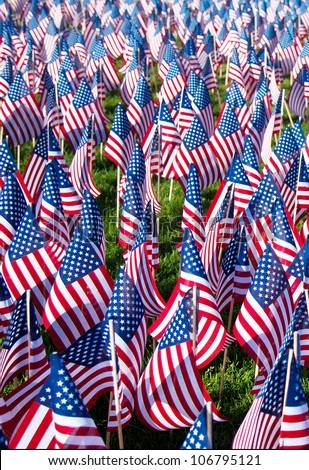 stock-photo-american-flags-on-display-for-memorial-day-or-july-th-hundreds-of-flags-cover-a-green-field-106795121.jpg