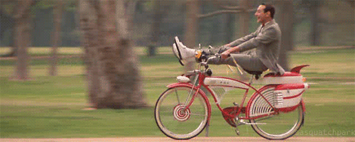 pee-wee-herman-riding-his-bike.gif