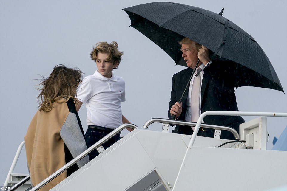 482CAD4700000578-5273011-Also_not_pictured_under_the_umbrella_was_wife_Melania_47_Trump_k-a-4_1516108213414.jpg