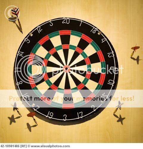darts_stuck_around_dart_board_42-18981486.jpg