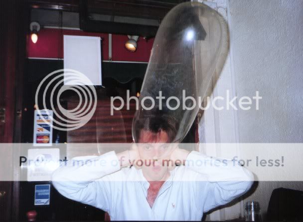 condom-being-inflated-over-mans-head.jpg