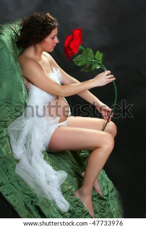 stock-photo-beautiful-pregnant-woman-with-flower-vintage-style-studio-shot-great-for-calendar-47733976.jpg