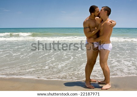 stock-photo-two-gay-men-standing-at-the-beach-kissing-22187971.jpg