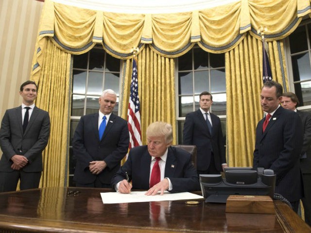 Trump-signing-orders-gold-drapes-getty-640x480.jpg