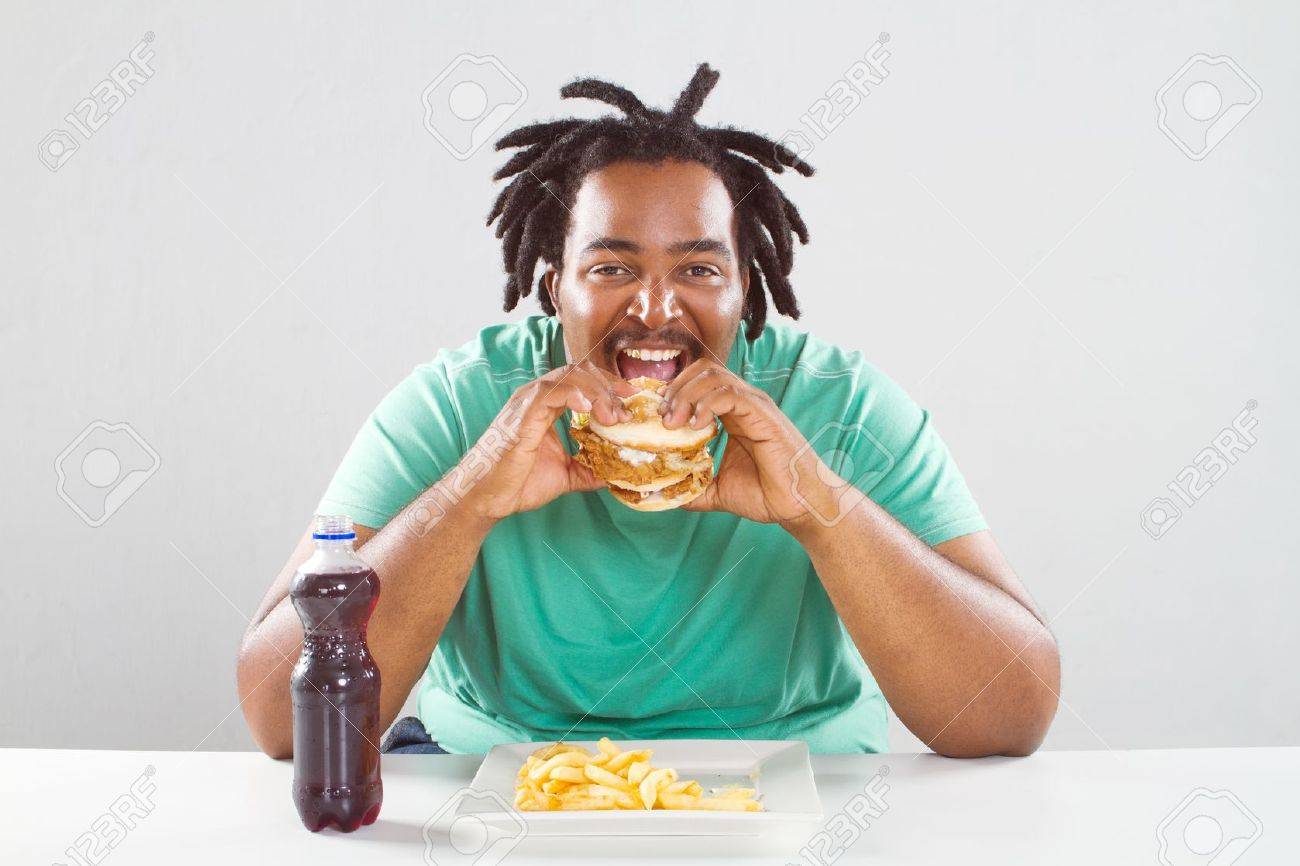 9844243-happy-fat-african-american-man-eating-a-hamburger-Stock-Photo-fat.jpg