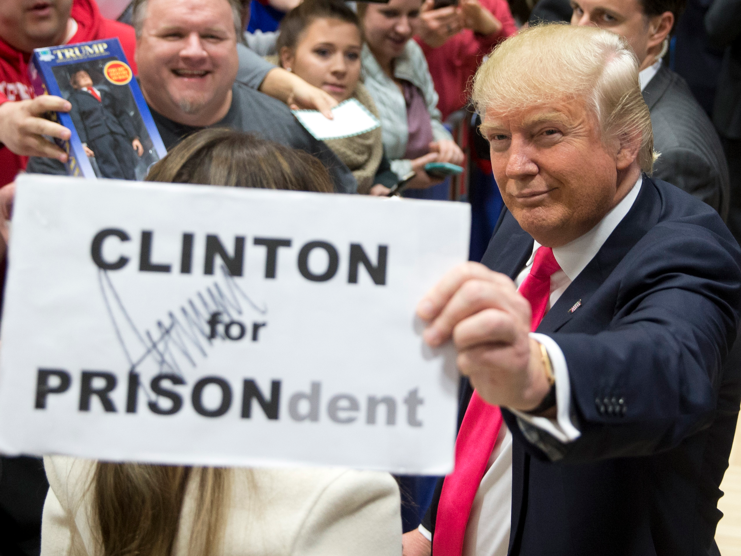 3-photos-of-donald-trump-holding-up-a-hillary-clinton-for-prison-sign.jpg