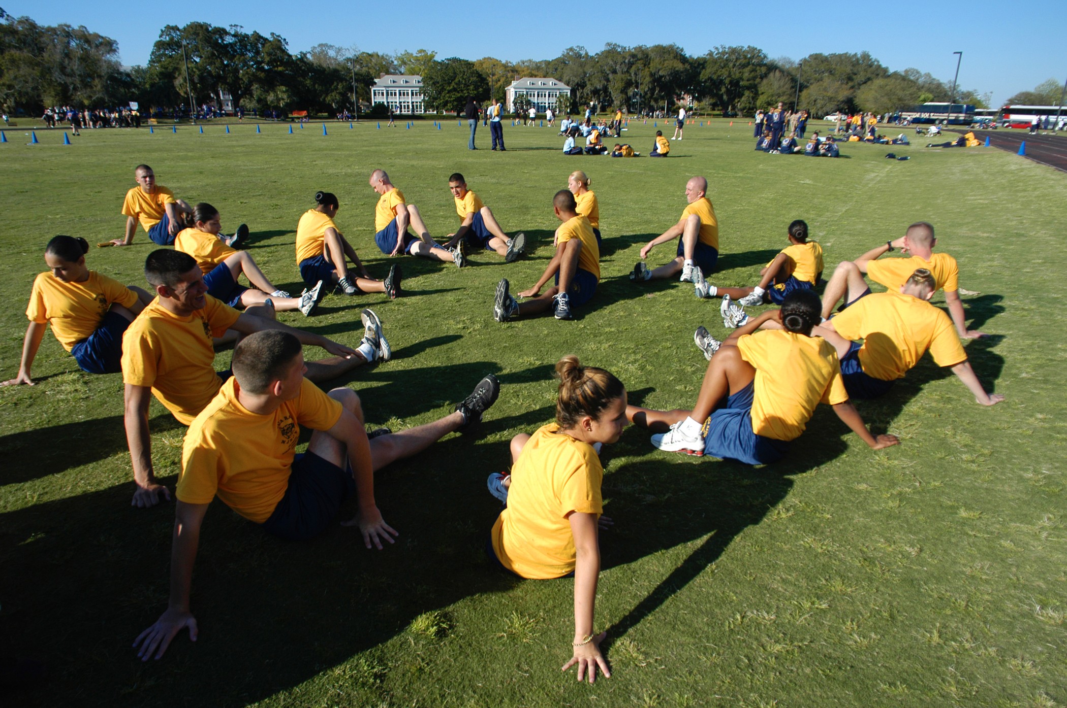 US_Navy_040302-N-5328N-005_Naval_Junior_Reserve_Officers_Training_Corps_%28NJROTC%29_cadets_from_Boca_Raton_Community_High_School,_Fla.,_stretch_before_a_track_and_field_event.jpg
