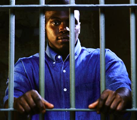 Black_man_behind_bars.jpg
